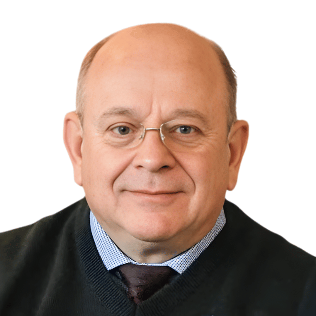 Middle-aged man in glasses smiling at camera